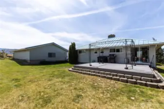Back of home, deck and garage