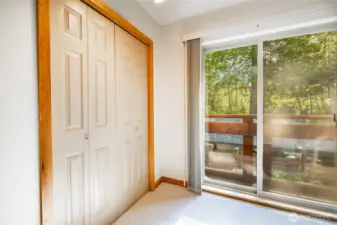 Main floor bedroom with slider and balcony