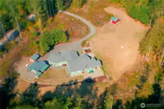 Sprawling rambler with 3 bdrms, 2.5 baths + den/office. Heated workshop space, barn w/hay storage, carports, dog run, fully fenced back yard, wood shed, storage shed, exansive patio and hot tub too!