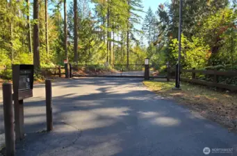 The home is located just inside the gate of the Jackson Forest, within the McKenna Forest Reserve. This gated community is more than 4,100 acres total, comprised of 20 acre parcels, divided into six neighborhoods. The road is paved, as is the driveway of this home.
