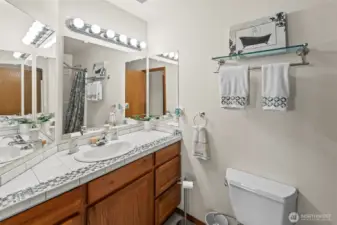 Main Bathroom off the hallway is a full bath, also with custom tile work.