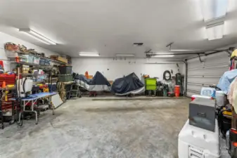 One of a kind 3 car garage with the end bay being fully isolated and insulated with it's own thermostatically controlled forced air heat and a half bath!
