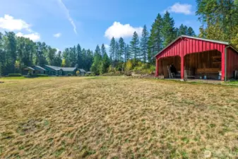 The barn / stable is approximately 20' x 20' total. The open section for the animals in the front is about 20' wide by 11'6" deep. There is an enclosed area in the back for hay, a tack room or storage.