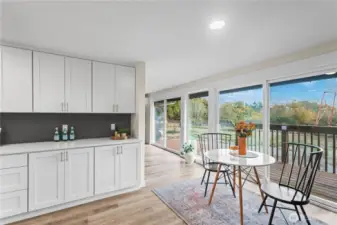 Buffet area from kitchen with dining room & view of rear yard.