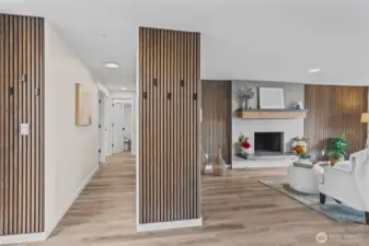 Welcome Home!  Flooring, wainscott trim, a custom fireplace with mantel & hearth. Everything is warm & inviting.