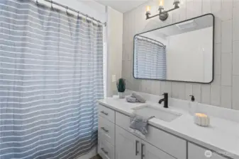 Second full bath off of Jr. bedrooms. Notice the beautiful tile work.