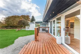 Custom rear deck overlookiing rear yard (complete with cupholders)