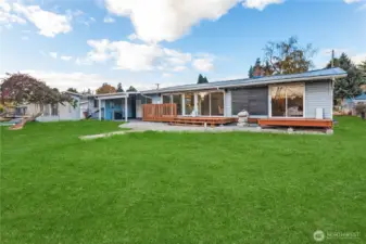 Rear view of home, grass edited to show potential