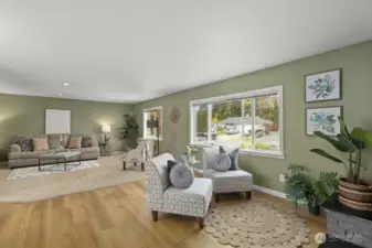 Room for a separate sitting area in front of the fireplace, plus a spacious living area.