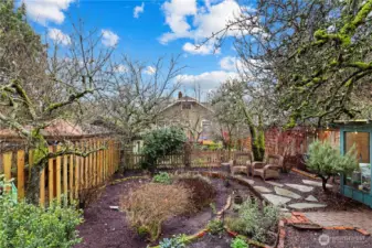 Rain-garden already in place with a shed...fruit trees, blueberries, what else could you grow?  LOOK CLOSELY - there's a hot tub over in the corner!