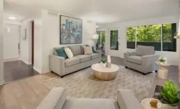 Living room with large windows allowing natural light to fill the space.