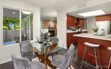 Dining area flowing seamlessly into kitchen and living area.