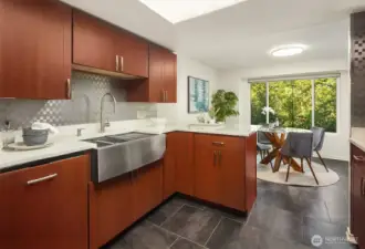 Bright kitchen looking out to dining area and breakfast bar.