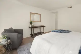 Primary bedroom with connection to ensuite bathroom.