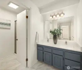 Updated, ensuite bathroom with heated floors and double vanity.