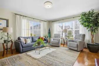 Another view showing the large living room with the gorgeous oak floors.