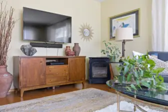 There is a free-standing gas fireplace in the corner of the living room to cozy-up those chilly winter nights!
