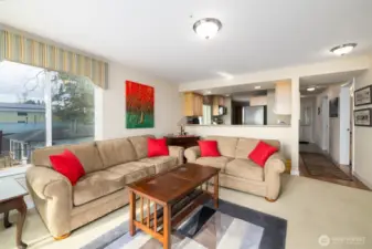 Living area looking back toward the kitchen and entry hall.