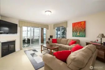 What could be better?  This comfortable living area offers a natural gas fireplace to cozy up to as you watch winter storms roll in over the bay, and a huge sliding glass door to open for those magical breezes off the water when summer hits.  Perfect indoor-outdoor living space with room for everyone.