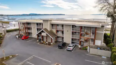 Birch Bay's distinct crescent shape creates gentle, shallow waters ideal for wading, beachcombing, and relaxing beach days. The Sands Condominiums sits directly across Birch Bay Drive from the water, giving you beachfront property without the beachfront taxes.  Unit 206 is on the second floor, far right..