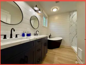 Primary 4-piece bathroom.  Oh how sweet! Dual sinks, soaking tub, shower, and water closet.