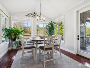 This sunny eating area is located directly off the kitchen, with access to the wrap-around porch.