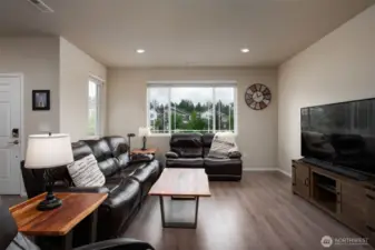 Livingroom overlooks the front yard and community play area