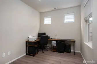Floorplan features flex space for office or den.