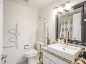 One main floor bathroom, with walk in shower/tub