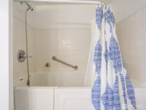 Walk-in tub/shower.