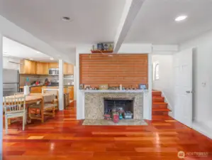Downstairs living room w/wood burning fireplace