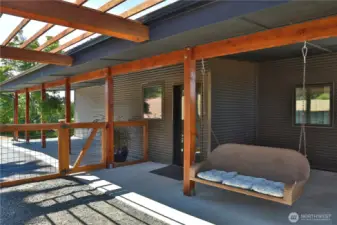 Outdoor fenced area with carport & driveway