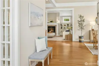 The spacious entryway opens up to the light-filled communal hub in the center of the home, complete with hardwood floors.