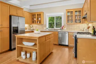 Hardwood floors extend through the kitchen, bringing warmth and quality to the smart floorplan.