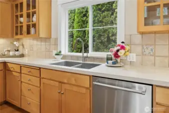 Great natural light and nice privacy out to the green-space views from the kitchen.