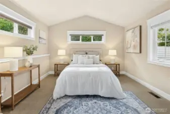 The private primary suite features a spacious walkthrough closet and ensuite bathroom.
