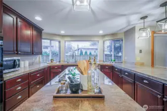 Enjoy the center island for prep work, with large picture windows filling the space with natural light.