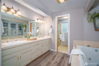 Enjoy an oversized jetted tub, dual vanities, and abundant storage.