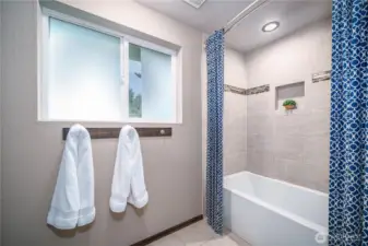 The bath also features a beautiful tile surround.