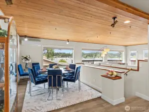 Adjacent from the Kitchen and Island Eating Space You Step into the Formal Dining Area, all while Soaking in the Lovely Water Views.
