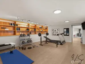 Virtually Staged this Space as Your Weight Room as it is Next to the 3 Car Garage.