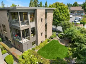 End-unit with two private balconies, and a vibrant side garden, making for great views throughout.