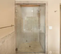 Shower in primary, across from the tub.