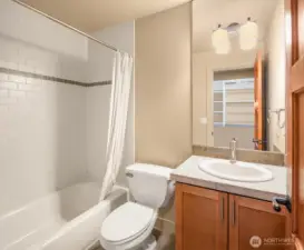 Full bathroom, and view of the built out closet, within the 2nd bedroom en-suite.