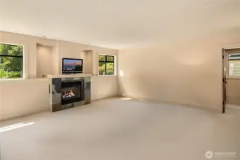 3rd bedroom, pictured empty, looking towards the door to wet bar and bathroom.