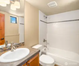 Full bathroom on main floor next to bonus room.