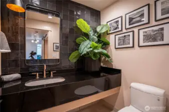 Stylish and modern half-bath in the entry area.