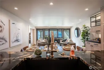 Striking solid slab marble kitchen counters and stylish gold fixtures are highlights in the kitchen with lake views always in sight.