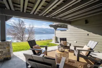 Spacious covered patio outside the living room lets you enjoy the outdoors any time of year. Pre-wired for ceiling patio heaters and pre-wired for your private hot tub addition.