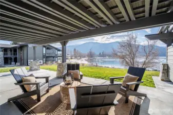 Covered patio extends from the living room area to in front of the primary bedroom.